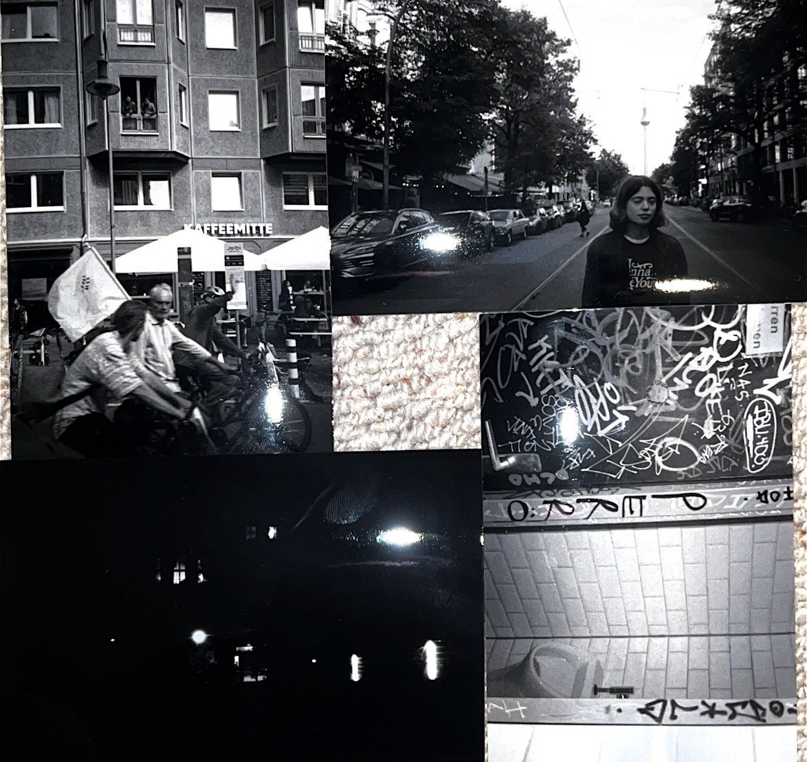 Black and white image of the streets of Berlin, many different photos of buildings, streets, people, graffiti of different sizes.